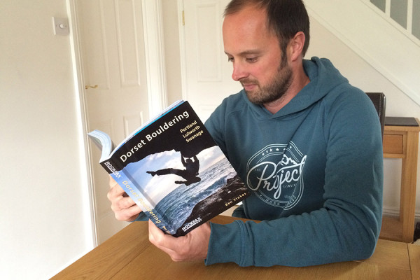 Author Ben Stokes with a copy of the new Dorset Bouldering guidebook.